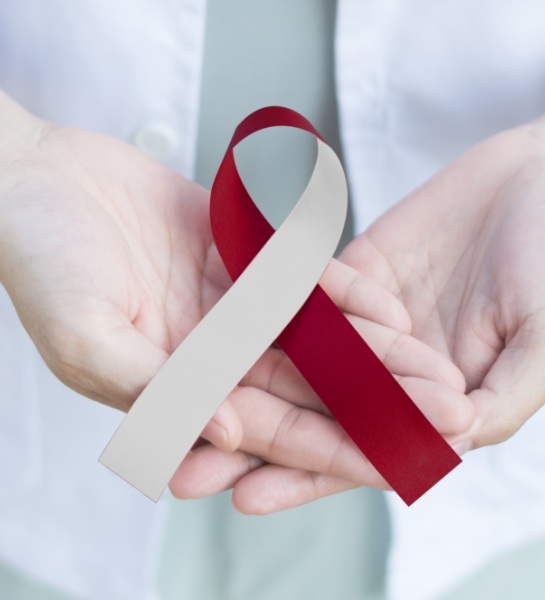 Dentist holding oral cancer awareness ribbon