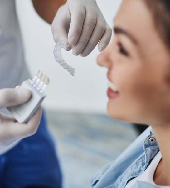 Dentist explaining to patient how to get started with Invisalign