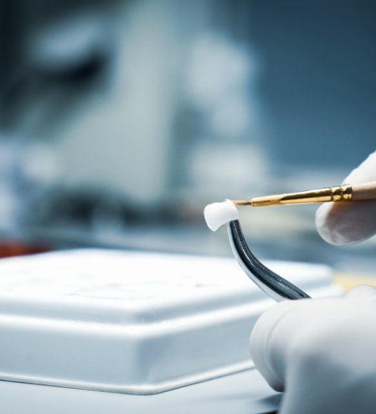 Dental team member crafting dental crown