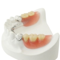 Full denture in glass of water