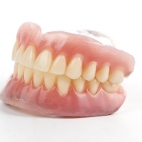Smiling older man in dental chair