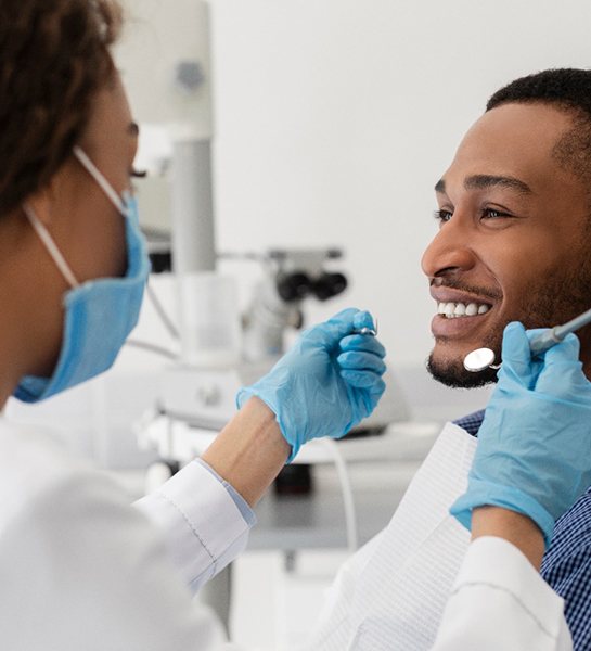patient visiting the dentist to care for his teeth and implants