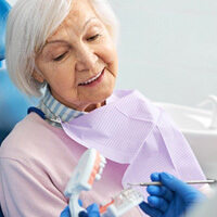 Dental Implant consultation between female patient and dentist