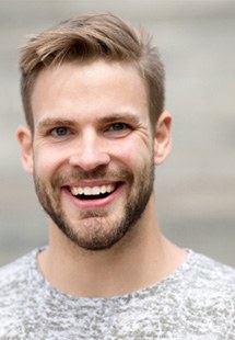 Close-up of man with grey shirt smiling