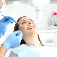 Woman smiling before veneer placement in Naples