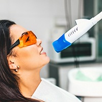 Dental patient receiving in office teeth whitening treatment