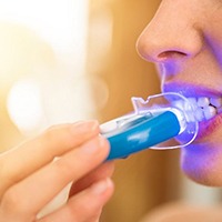 Dental patient receiving opalescence at home teeth whitening