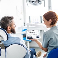 man learning about cost of teeth whitening in Naples