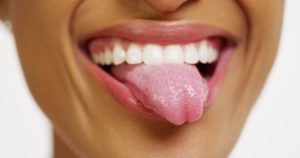 Woman showing tongue.