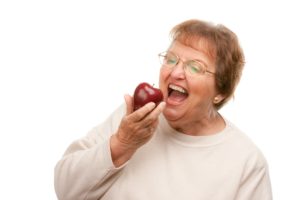 woman biting apple