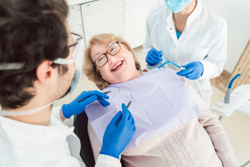 Senior patient smiling at routine dental appointment