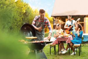 Group of friends at barbecue party outdoors