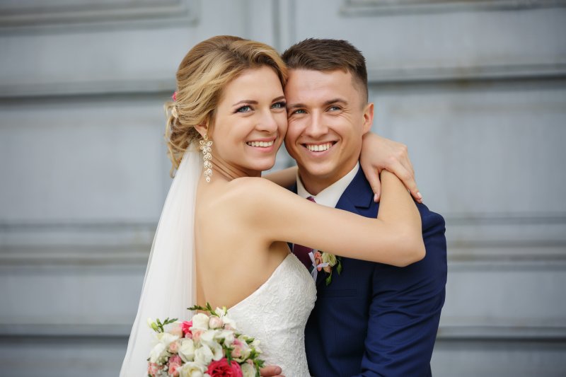 Young married couple with shining smiles