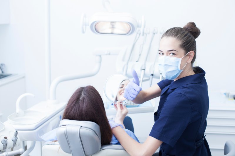 Dental assistant giving a thumbs up