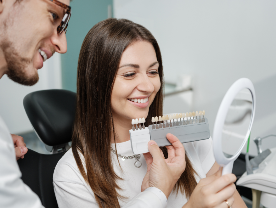 Dentist showing woman veneer options