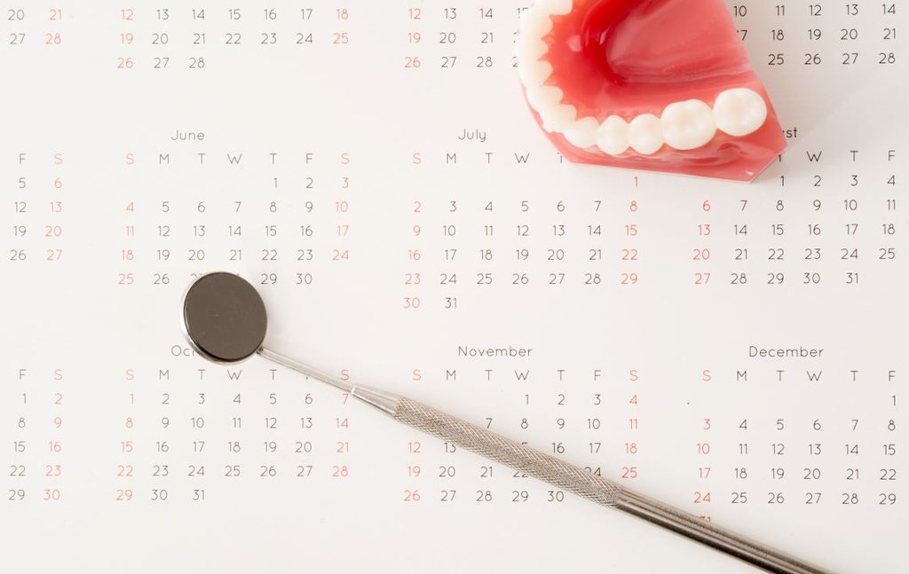 A denture on a desk calendar